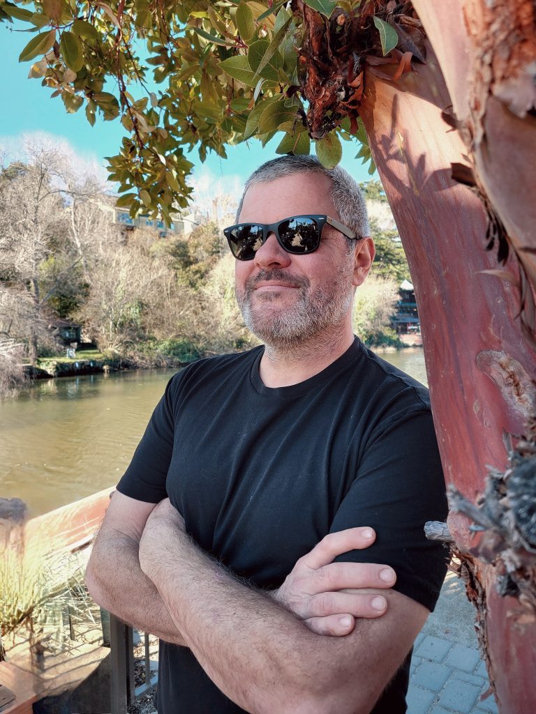 Chef Sean in front of a Madrona tree